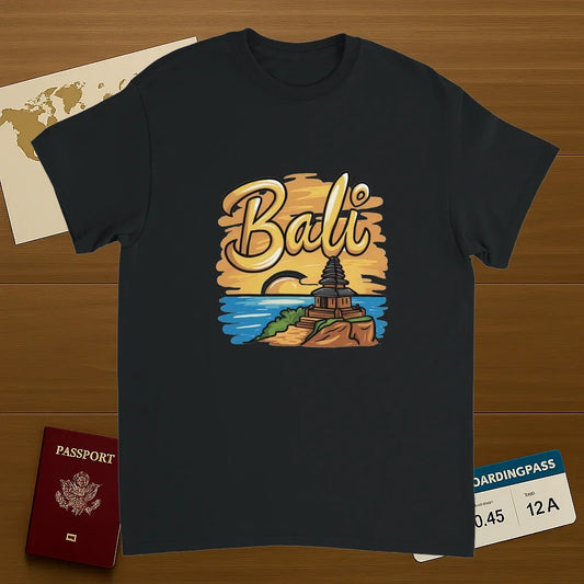 black Bali Unisex Travel T-Shirt on wooden background with world map, passport, and boarding pass