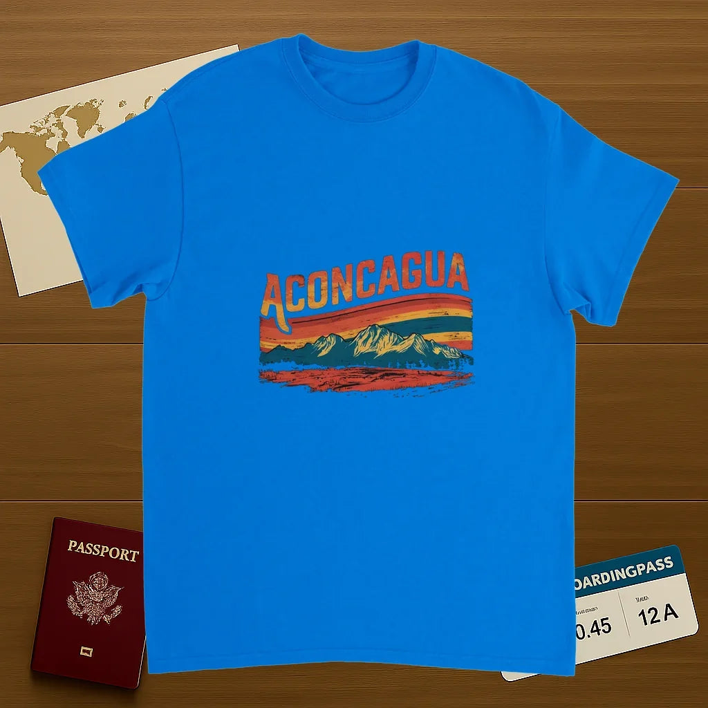 royal blue Aconcagua Argentina Unisex Travel T-Shirt on wooden background with world map, passport, and boarding pass