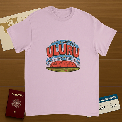 light pink Uluru Australia Unisex Travel T-Shirt on wooden background with world map, passport, and boarding pass