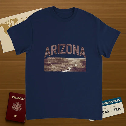 navy Arizona USA Unisex Travel T-Shirt on wooden background with world map, passport, and boarding pass