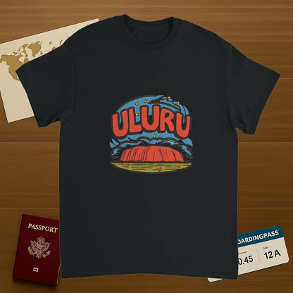 black Uluru Australia Unisex Travel T-Shirt on wooden background with world map, passport, and boarding pass