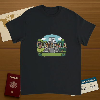 black Guatemala Unisex Travel T-Shirt on wooden background with world map, passport, and boarding pass
