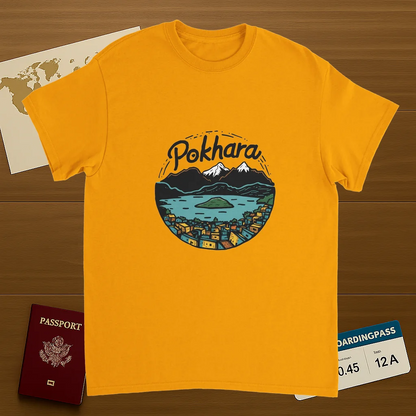 gold Pokhara Nepal Unisex Travel T-Shirt on wooden background with world map, passport, and boarding pass