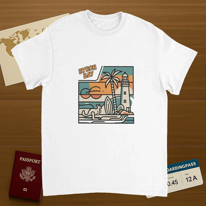 white Byron Bay Australia Unisex Travel T-Shirt on wooden background with world map, passport, and boarding pass