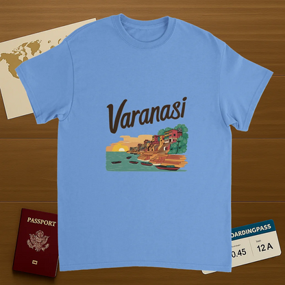 carolina blue Varanasi India Unisex Travel T-Shirt on wooden background with world map, passport, and boarding pass