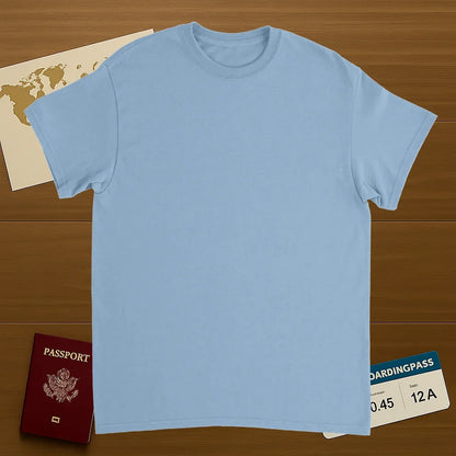 light blue Cusco Peru Unisex Travel T-Shirt on wooden background with world map, passport, and boarding pass