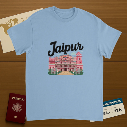 light blue Jaipur India Unisex Travel T-Shirt on wooden background with world map, passport, and boarding pass