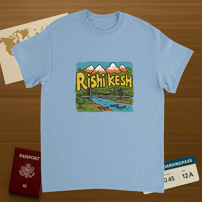 light blue Rishikesh India Unisex Travel T-Shirt on wooden background with world map, passport, and boarding pass