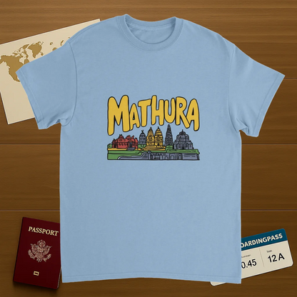 light blue Mathura India Unisex Travel T-Shirt on wooden background with world map, passport, and boarding pass