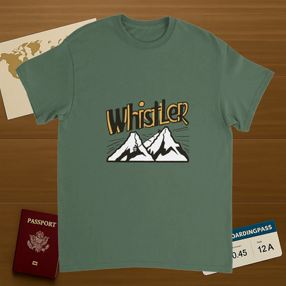military green Whistler Canada Unisex Travel T-Shirt on wooden background with world map, passport, and boarding pass