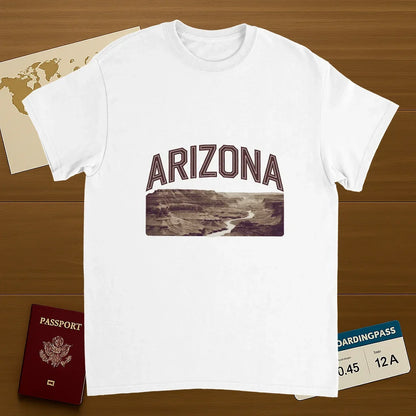 white Arizona USA Unisex Travel T-Shirt on wooden background with world map, passport, and boarding pass