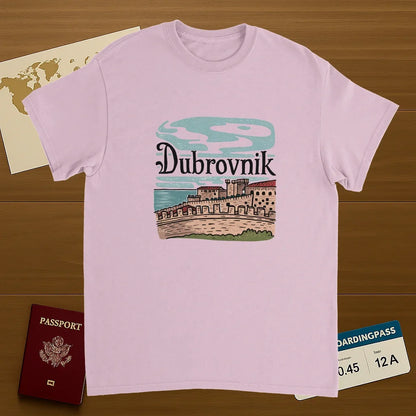 light pink Dubrovnik Croatia Unisex Travel T-Shirt on wooden background with world map, passport, and boarding pass