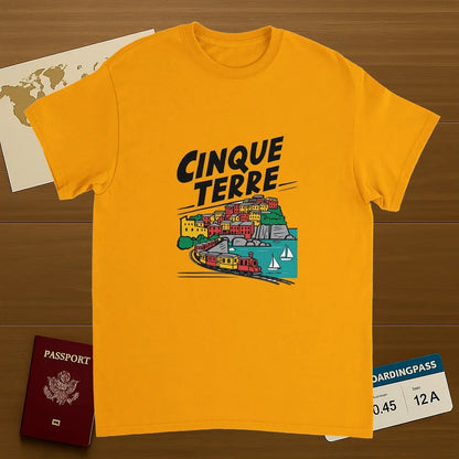 gold Cinque Terre Italy Unisex Travel T-Shirt on wooden background with world map, passport, and boarding pass