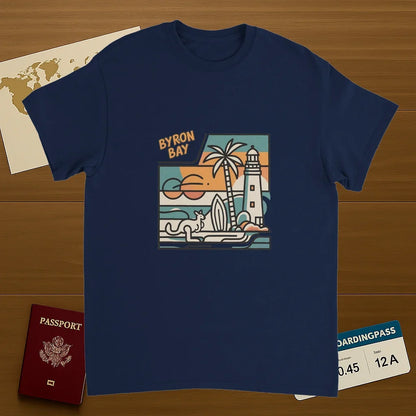 navy Byron Bay Australia Unisex Travel T-Shirt on wooden background with world map, passport, and boarding pass