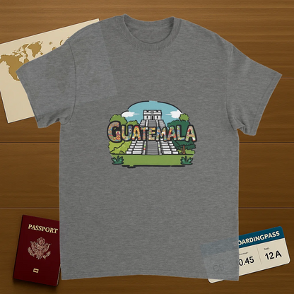 sport grey Guatemala Unisex Travel T-Shirt on wooden background with world map, passport, and boarding pass