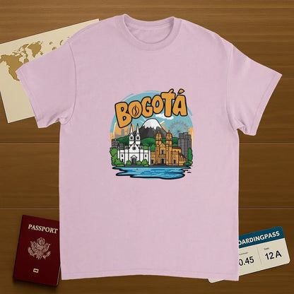 light pink Bogotá Colombia Unisex Travel T-Shirt on wooden background with world map, passport, and boarding pass