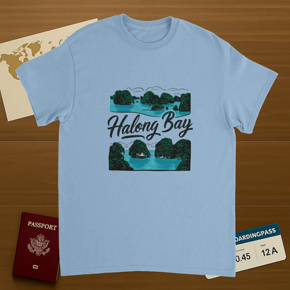 light blue Halong Bay Vietnam Unisex Travel T-Shirt on wooden background with world map, passport, and boarding pass