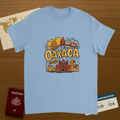 light blue Oaxaca Mexico Unisex Travel T-Shirt on wooden background with world map, passport, and boarding pass