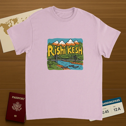 light pink Rishikesh India Unisex Travel T-Shirt on wooden background with world map, passport, and boarding pass