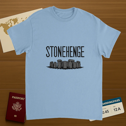 light blue Stonehenge England Unisex Travel T-Shirt on wooden background with world map, passport, and boarding pass