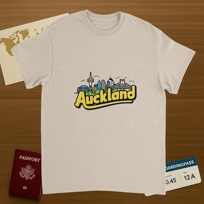 Auckland New Zealand Unisex Travel T-Shirt on wooden background with world map, passport, and boarding pass