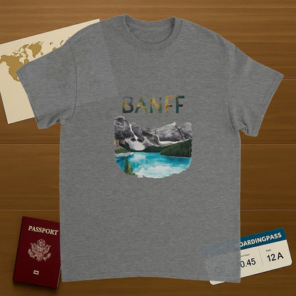 sport grey Banff Canada Unisex Travel T-Shirt on wooden background with world map, passport, and boarding pass