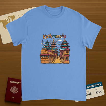 carolina blue Kathmandu Nepal Unisex Travel T-Shirt on wooden background with world map, passport, and boarding pass