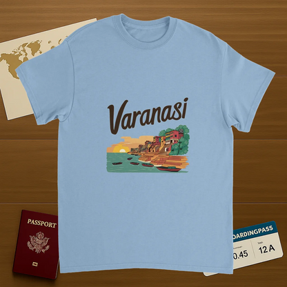 light blue Varanasi India Unisex Travel T-Shirt on wooden background with world map, passport, and boarding pass