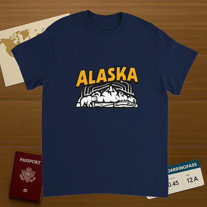 navy Alaska USA Unisex Travel T-Shirt on wooden background with world map, passport, and boarding pass
