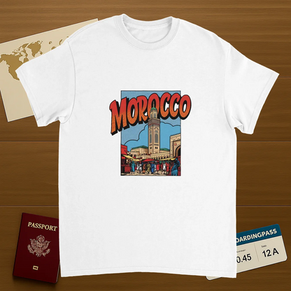 white Morocco Unisex Travel T-Shirt on wooden background with world map, passport, and boarding pass
