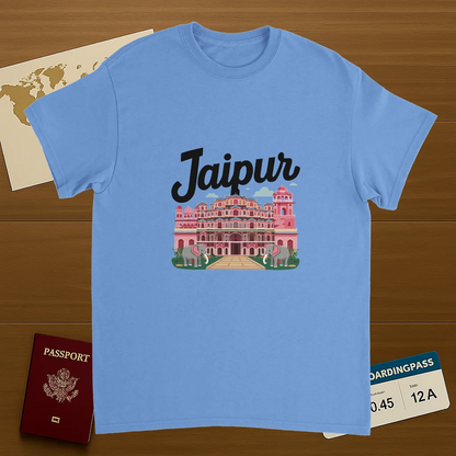 carolina blue Jaipur India Unisex Travel T-Shirt on wooden background with world map, passport, and boarding pass