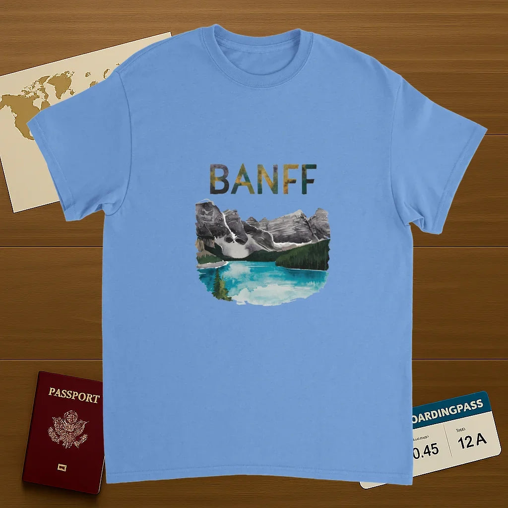 carolina blue Banff Canada Unisex Travel T-Shirt on wooden background with world map, passport, and boarding pass
