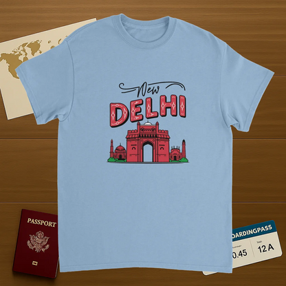 light blue New Delhi India Unisex Travel T-Shirt on wooden background with world map, passport, and boarding pass