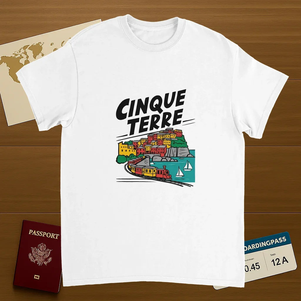 white Cinque Terre Italy Unisex Travel T-Shirt on wooden background with world map, passport, and boarding pass