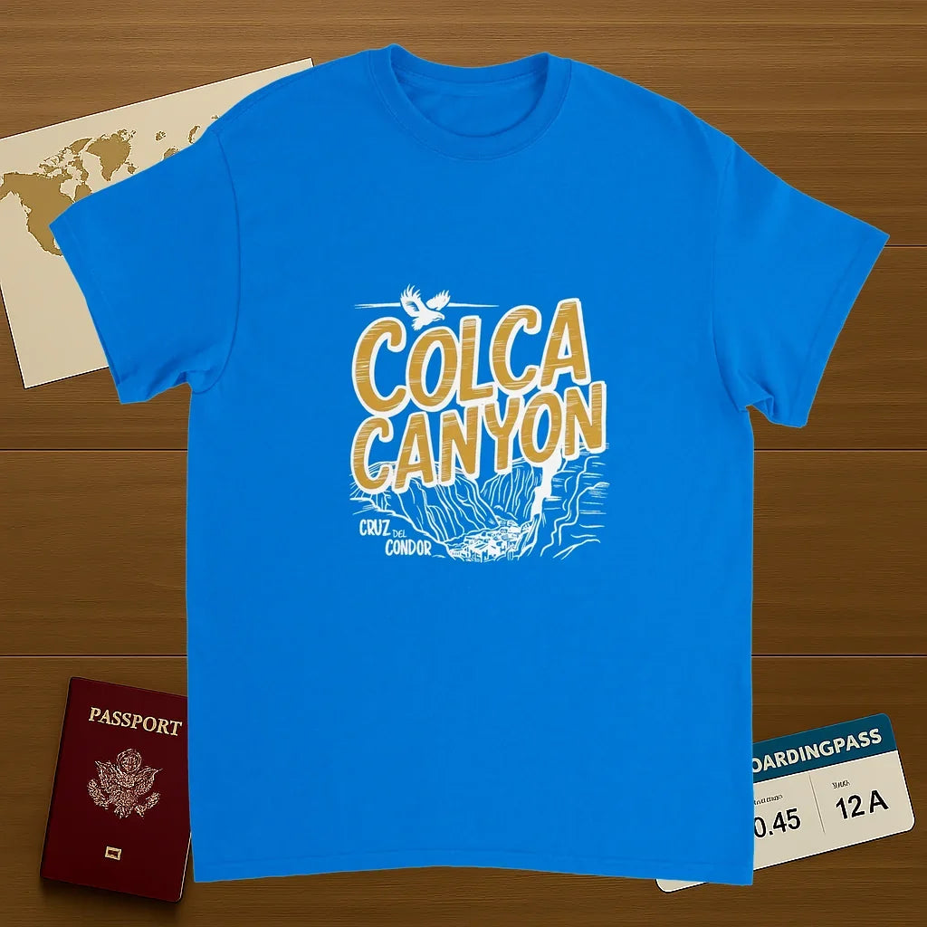 royal blue Colca Canyon Peru Unisex Travel T-Shirt on wooden background with world map, passport, and boarding pass